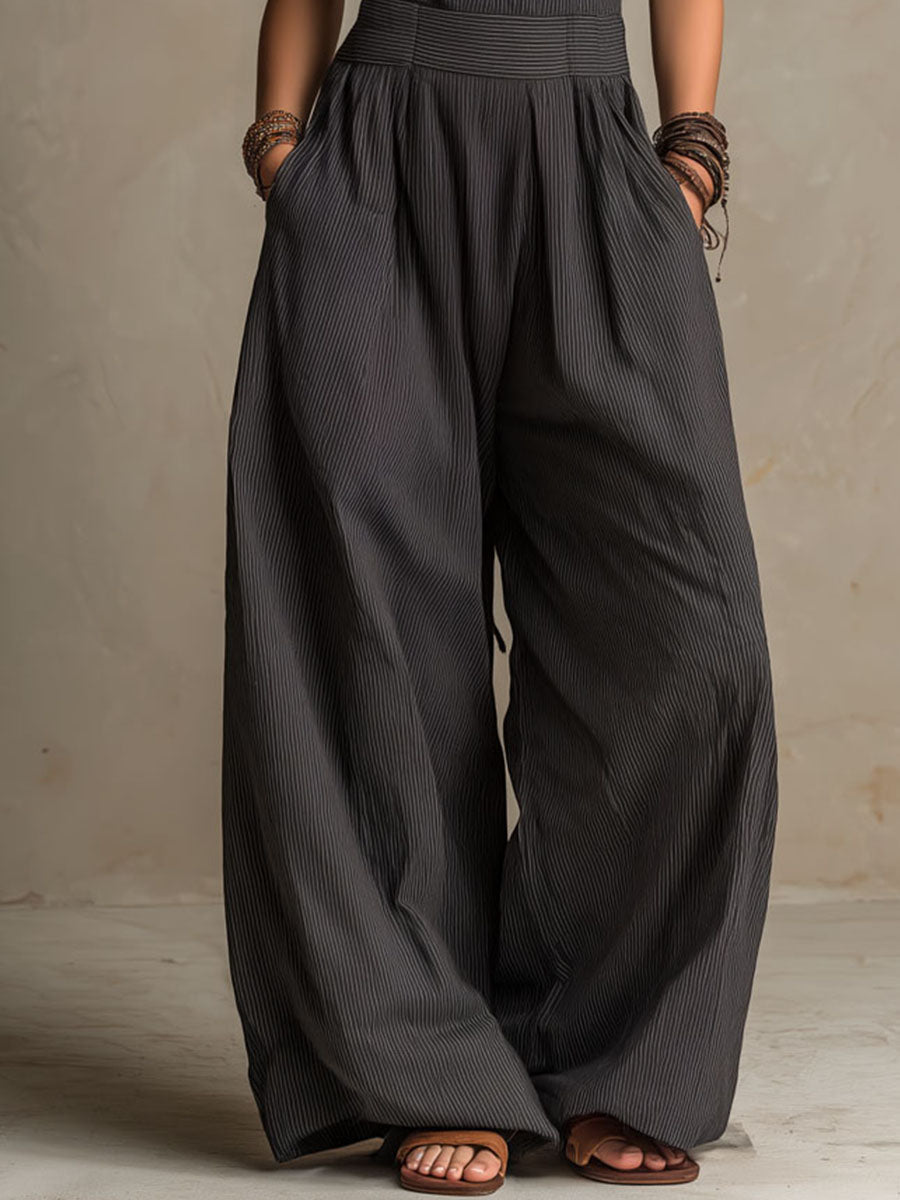 Valentina - Mono bohemio de pierna ancha con tirantes cruzados y escote halter, estampado de rayas diplomáticas.